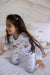 Smiling girl in Henry The Goose coloring pajama set